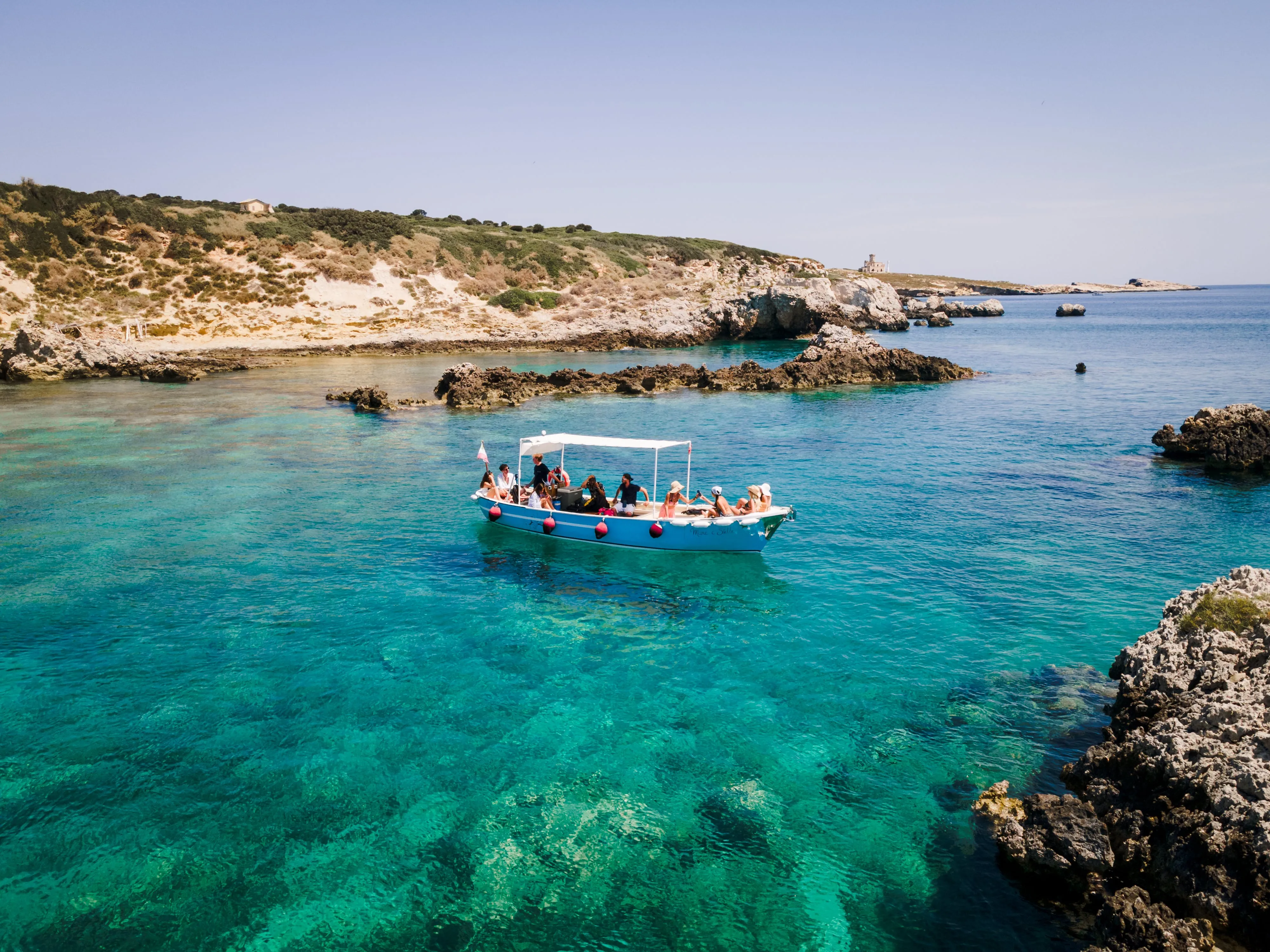 Open water swimming with support boat